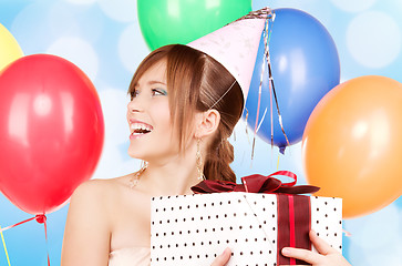 Image showing party girl with balloons and gift box