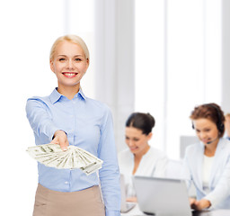 Image showing young businesswoman with dollar cash money