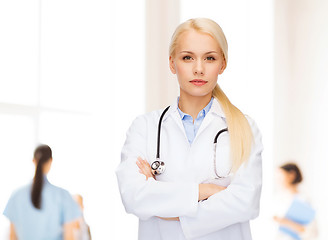 Image showing serious female doctor with stethoscope