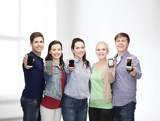 Image showing students showing blank smartphones screens