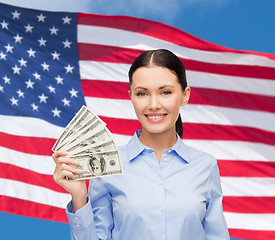 Image showing businesswoman with dollar cash money