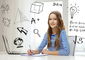 Image showing smiling teenage girl laptop computer and notebook