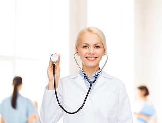 Image showing smiling female doctor with stethoscope