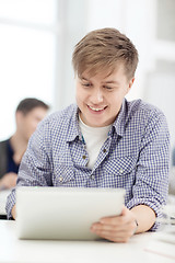 Image showing smiling teenage student with tablet pc computer