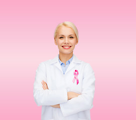 Image showing smiling female doctor with cancer awareness ribbon