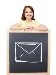 Image showing happy little girl with blackboard