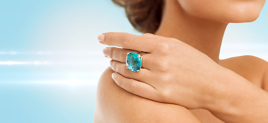 Image showing closeup of woman hand with big blue cocktail ring
