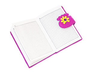 Image showing Open notebook in a purple cover on a white background        