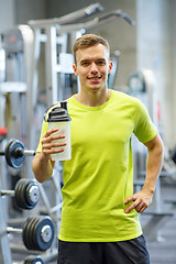 Image showing smiling man with protein shake bottle