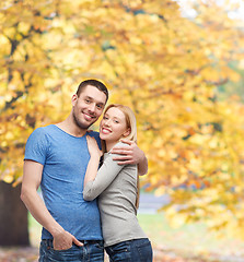 Image showing smiling couple hugging