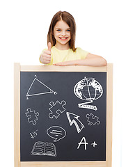 Image showing smiling girl with blackboard showing thumbs up
