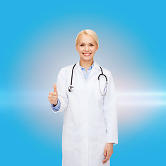 Image showing smiling female doctor showing thumbs up