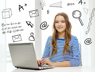 Image showing smiling teenage gitl with laptop computer at home