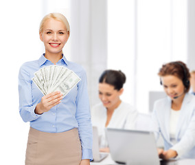 Image showing young businesswoman with dollar cash money