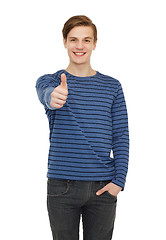 Image showing smiling teenage boy showing thumbs up