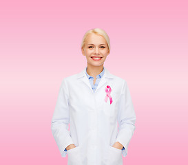 Image showing smiling female doctor with cancer awareness ribbon