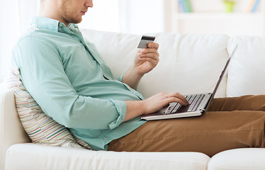 Image showing close up of man with laptop and credit card