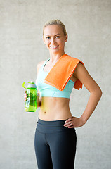 Image showing woman with bottle of water in gym