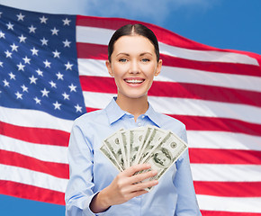 Image showing businesswoman with dollar cash money