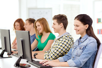 Image showing female student with classmates in computer class