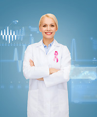 Image showing smiling female doctor with cancer awareness ribbon