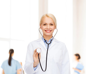 Image showing smiling female doctor with stethoscope