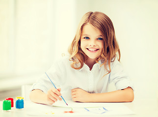 Image showing little girl painting at school