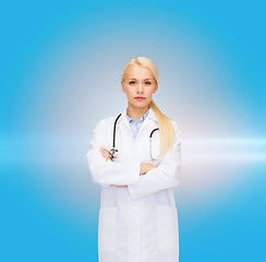 Image showing serious female doctor with stethoscope