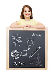 Image showing smiling girl with blackboard