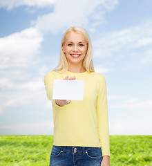 Image showing smiling girl with blank business or name card