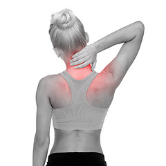 Image showing sporty woman touching her neck