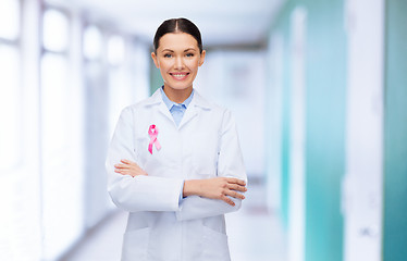 Image showing smiling female doctor with cancer awareness ribbon