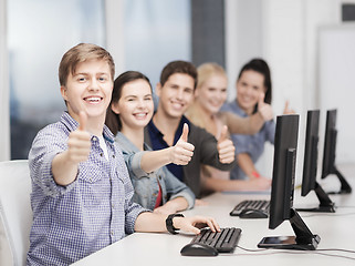 Image showing students with computer monitor showing thumbs up