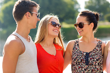 Image showing group of smiling friends in city