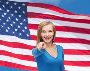 Image showing smiling student pointing finger at you