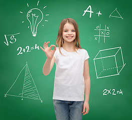 Image showing smiling girl in white t-shirt showing ok sign