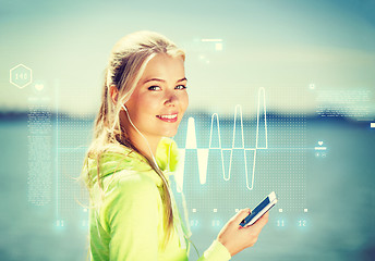 Image showing woman listening to music outdoors