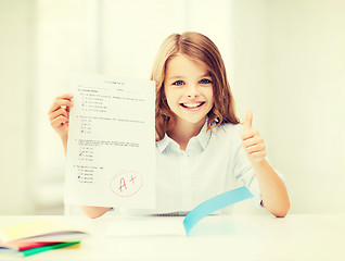 Image showing girl with test and grade at school