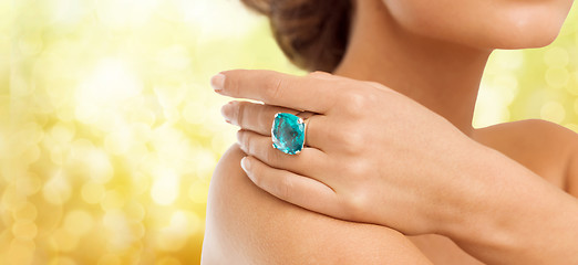 Image showing closeup of woman hand with big blue cocktail ring