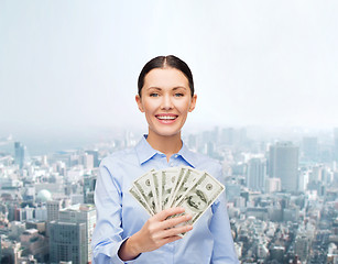 Image showing businesswoman with dollar cash money