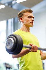 Image showing man doing exercise with barbell in gym