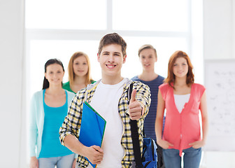Image showing male student with classmates showing thumbs up