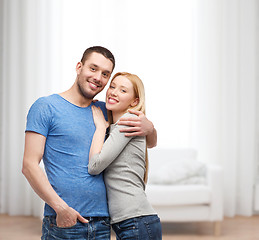 Image showing smiling couple hugging