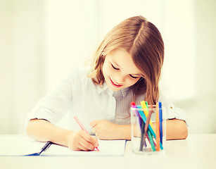 Image showing little student girl drawing at school