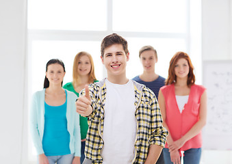 Image showing male student with classmates showing thumbs up