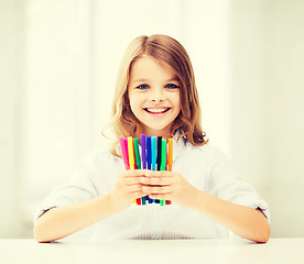 Image showing girl showing colorful felt-tip pens