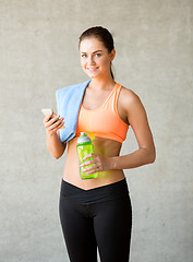 Image showing woman with bottle of water in gym