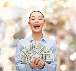 Image showing laughing businesswoman with dollar cash money