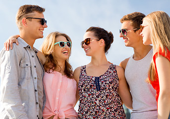 Image showing group of smiling friends in city