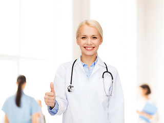 Image showing smiling female doctor showing thumbs up